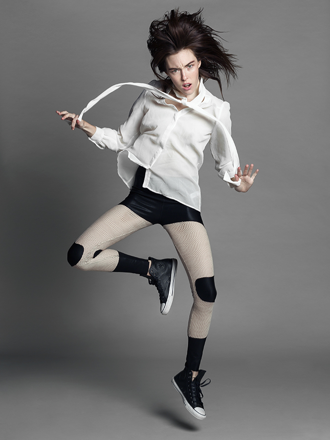 Britt Miles caught in motion posing in studio photographed by Joshua Pyles