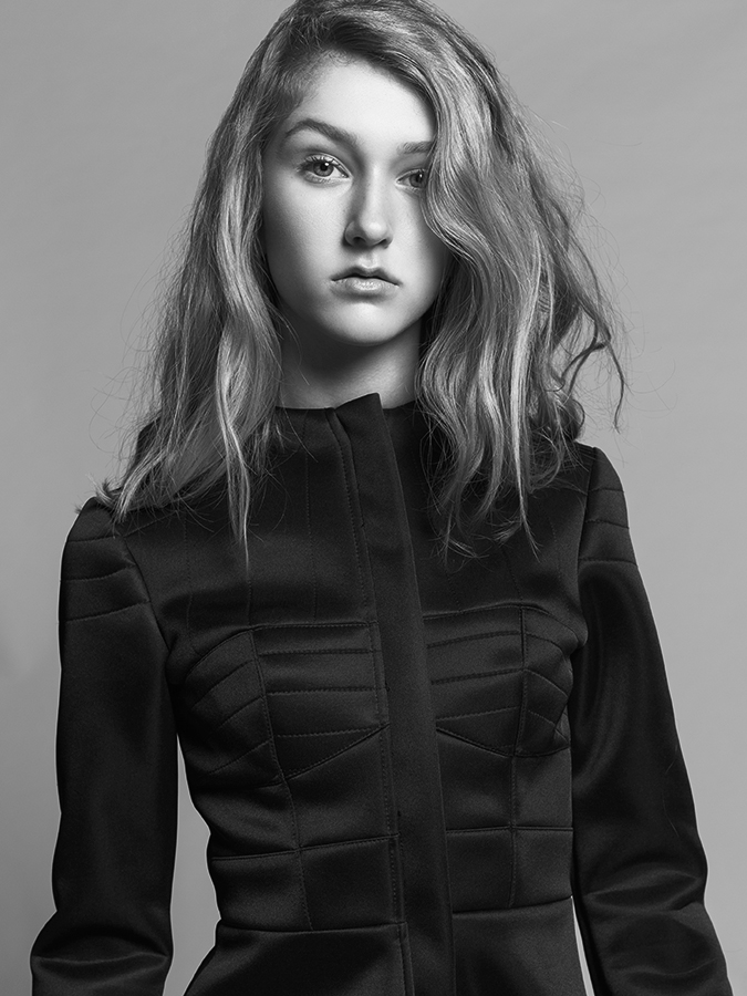 Portrait of model Ella Moss in high-fashion black geometric dress photographed by Joshua Pyles
