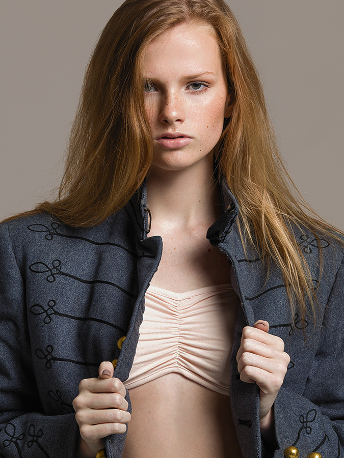 Next model Sarah Grace Pugh wearing cream bandeau top and wool costume jacket in headshot by Joshua Pyles