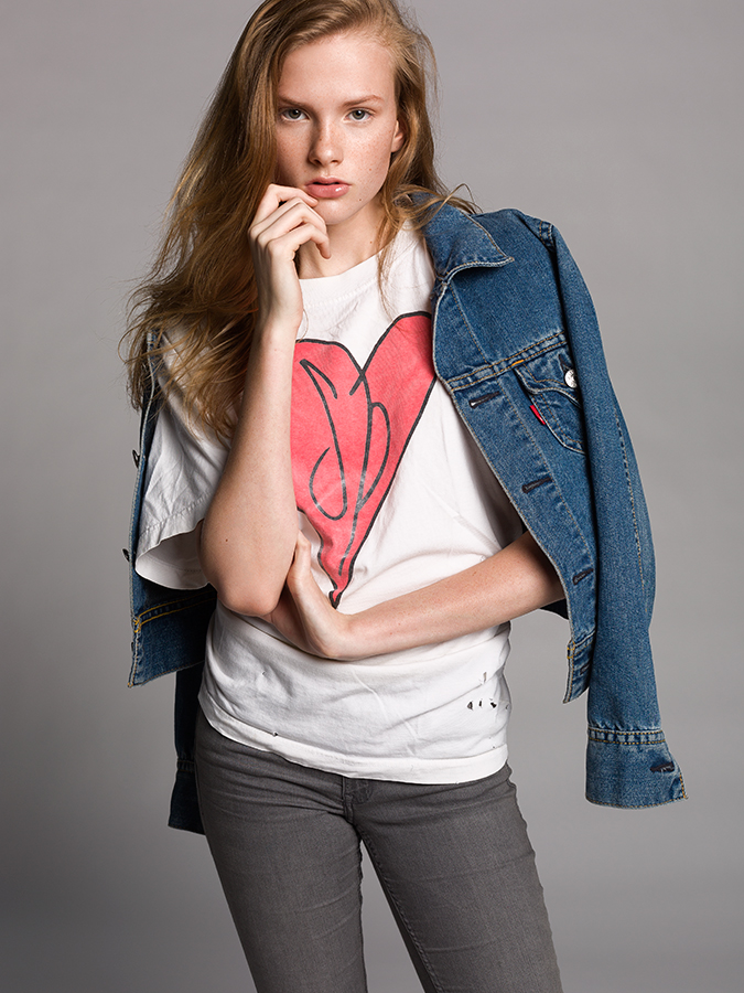 Next model Sarah Grace Pugh posing in white Smashing Pumpkins t-shirt and denim jacket photographed by Joshua Pyles