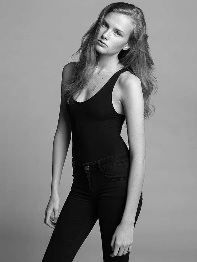 Model Sarah Grace Pugh photographed in a black bodysuit and black jeans by Joshua Pyles