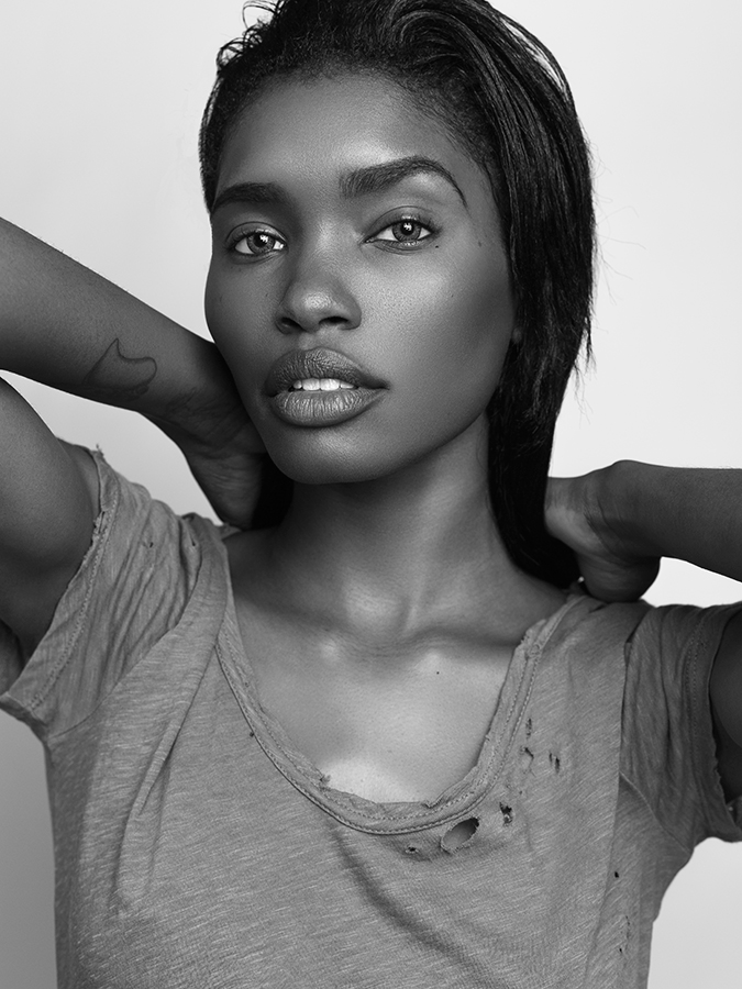 Model Tosh Bellington in shredded t-shirt photographed in black and white by Joshua Pyles